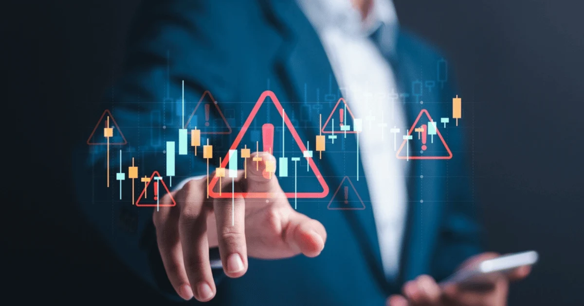 Chest in Suit Behind Stock Market Graph With Alert Symbols