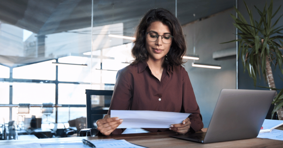 Women Bookkeeping With Laptop and Papers