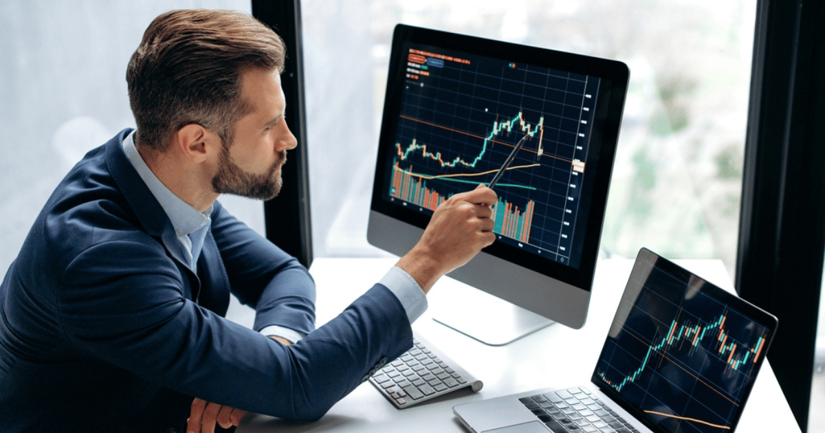 Man Analyzing Chart on Computer