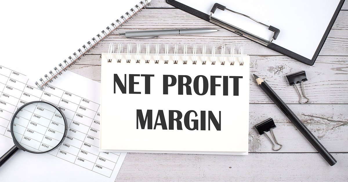 Net profit margin concept, text written on notebook