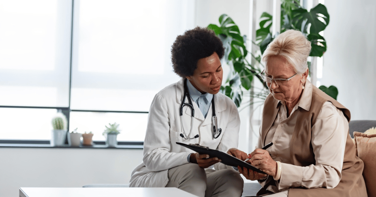 Doctor Helping Patient With Bill