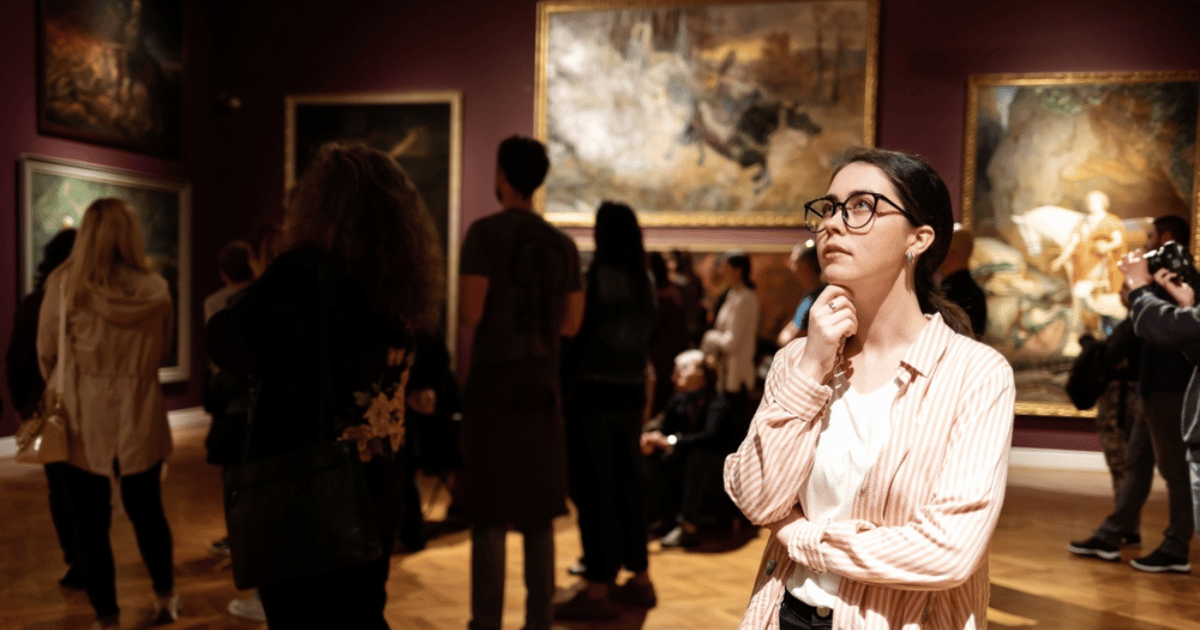 Woman Looking Pensive in Art Gallery
