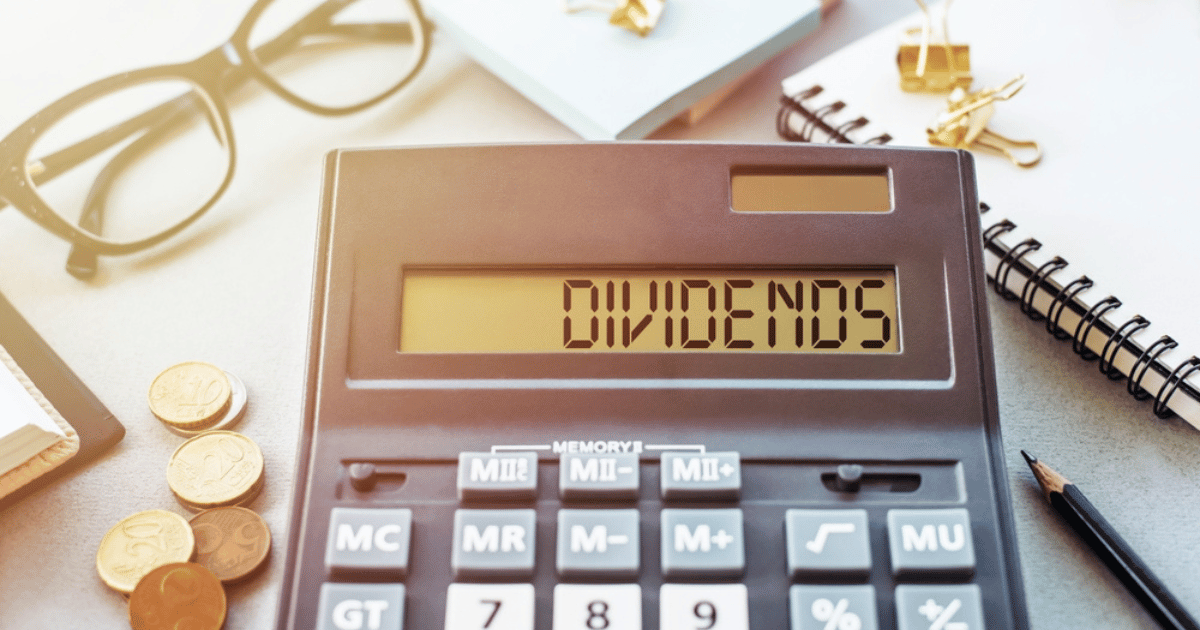 Dividends Spelled on Calculator on Desk